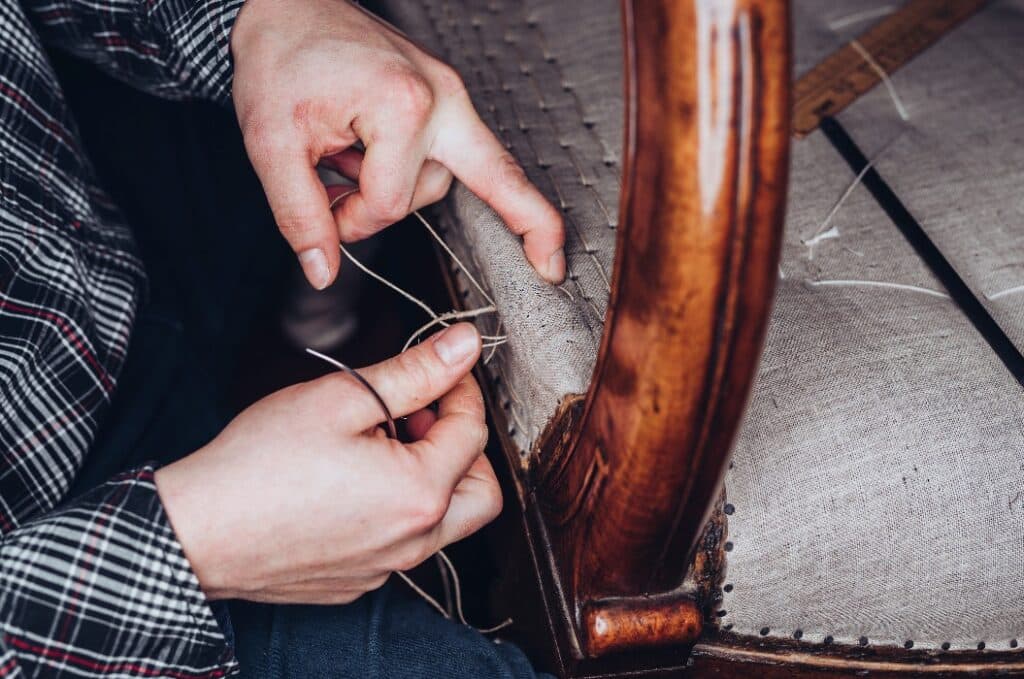 Upholster restoring an old chair